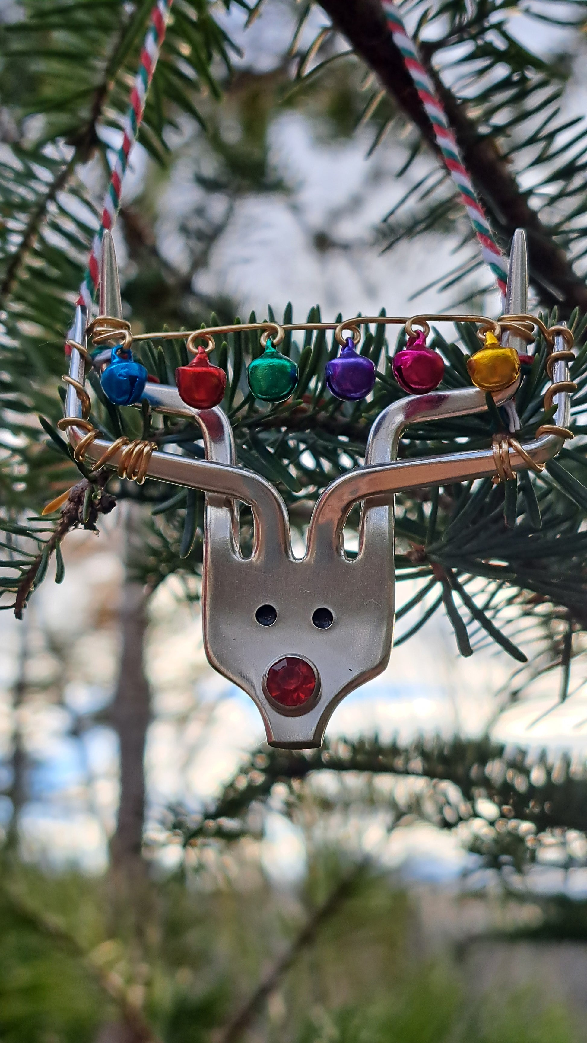 Handmade vintage silverware Christmas Ornament made from a fork shaped as a reindeer with christmas bells in antlers