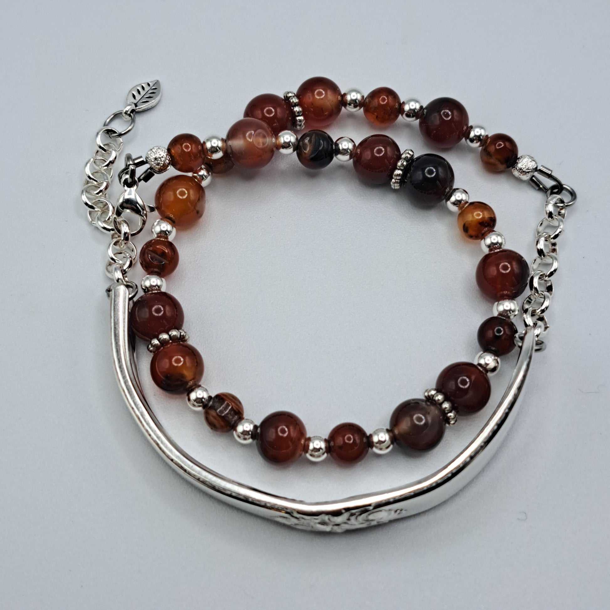 Handmade vintage silverware bracelet made from Adoration 1939 pattern silverplated handles with fire agate gemstone beads