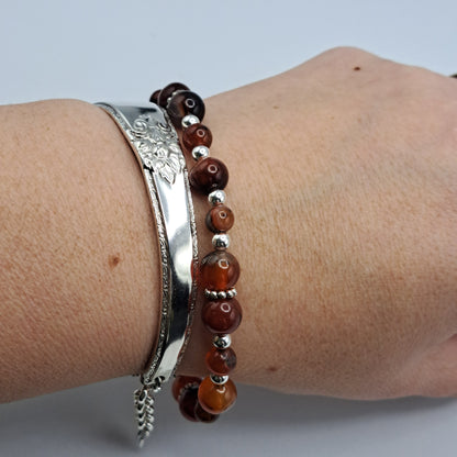 Handmade vintage silverware bracelet made from Adoration 1939 pattern silverplated handles with fire agate gemstone beads