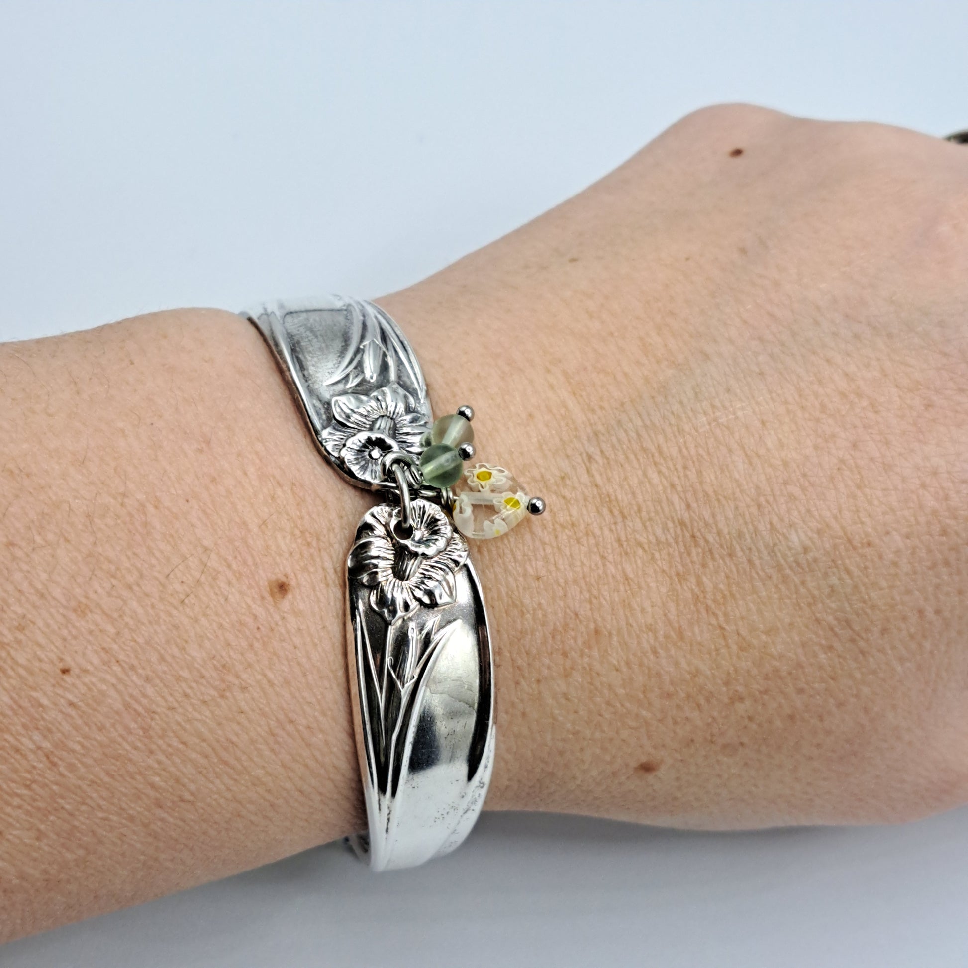 Handmade vintage silverware bracelet made from Daffodil 1950 pattern silverplated handles with center charm 