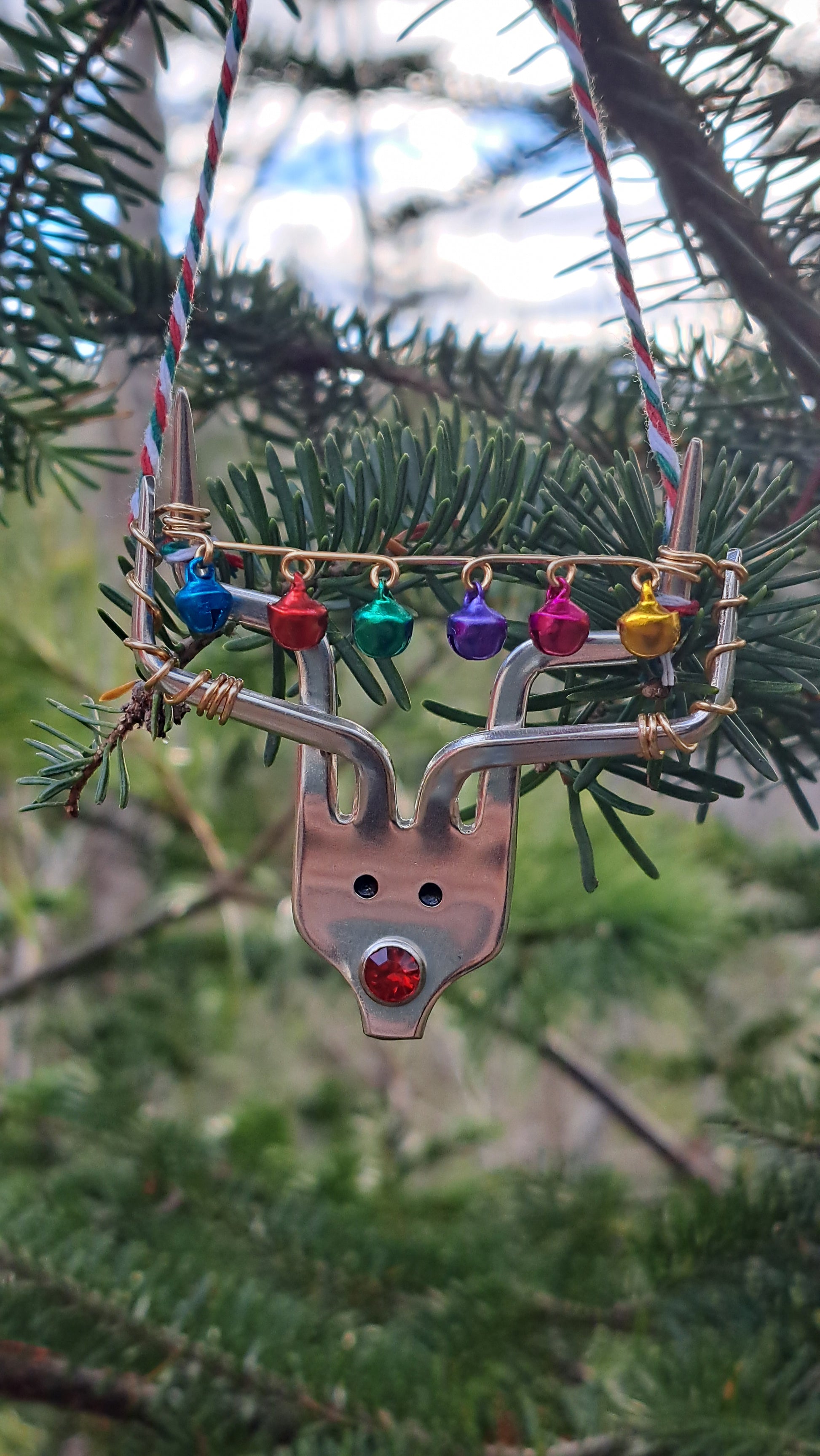 Handmade vintage silverware Christmas Ornament made from a fork shaped as a reindeer with christmas bells in antlers