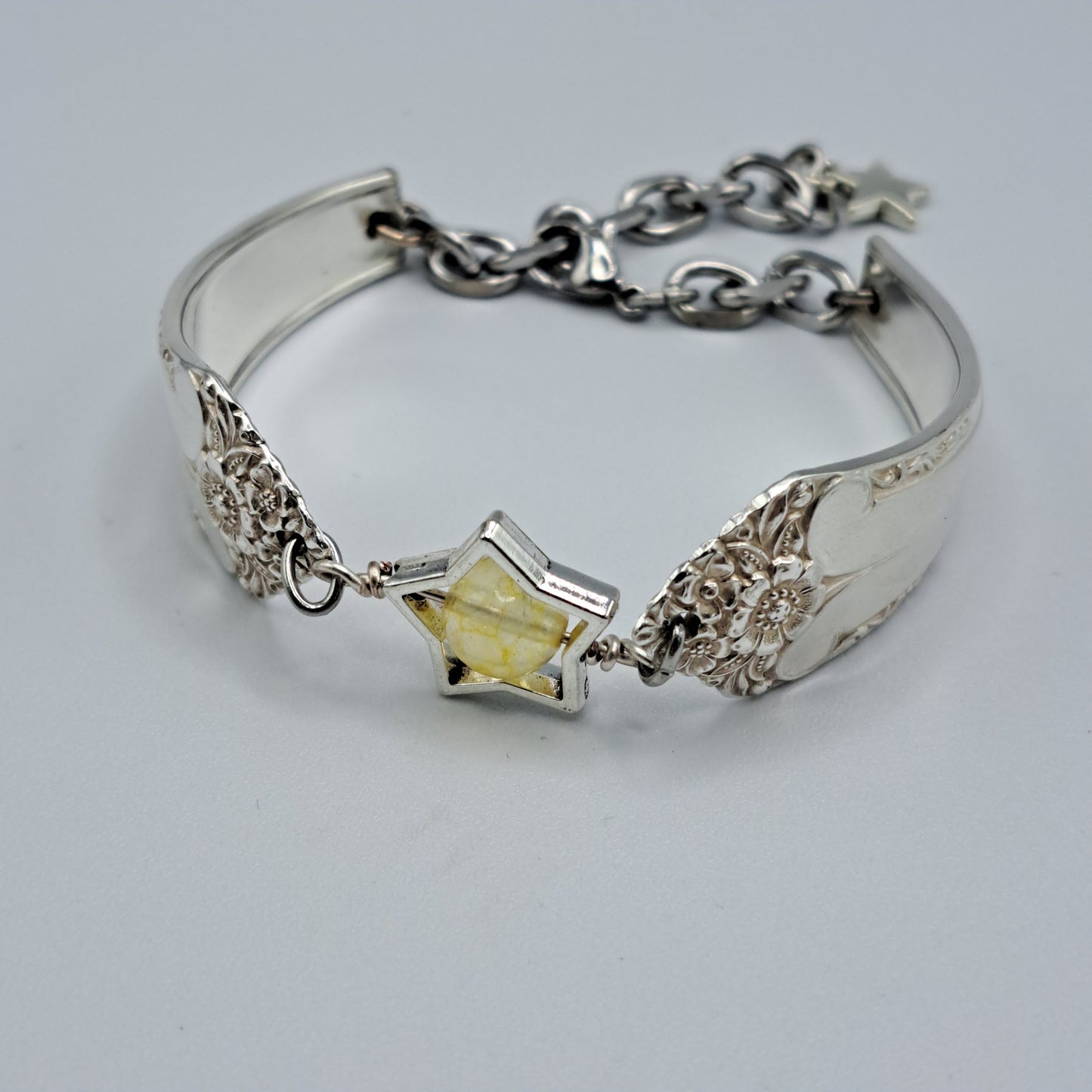 Handmade vintage silverware bracelet made from Starlight 1950 pattern silverplated handles with citrine gemstone center