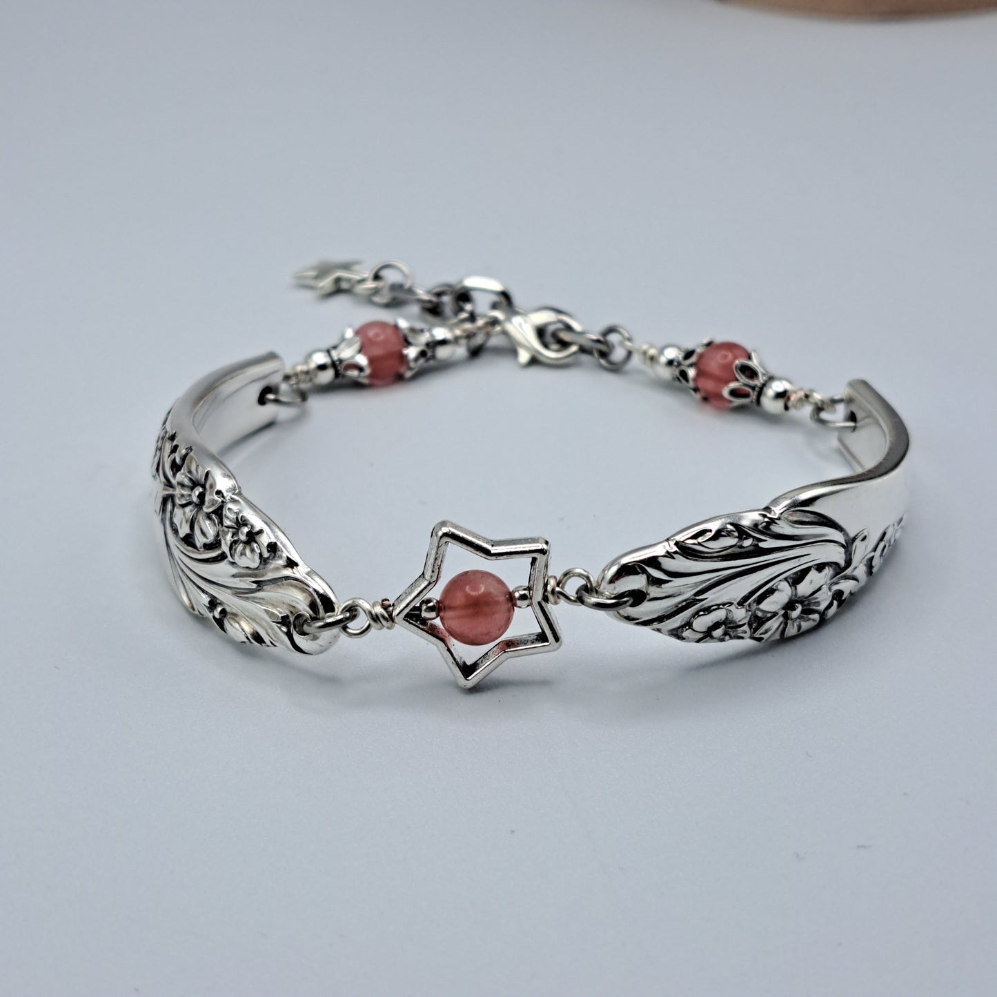 Handmade vintage silverware bracelet made from Evening Star 1950 silverplated handles with center cherry quartz and side beads