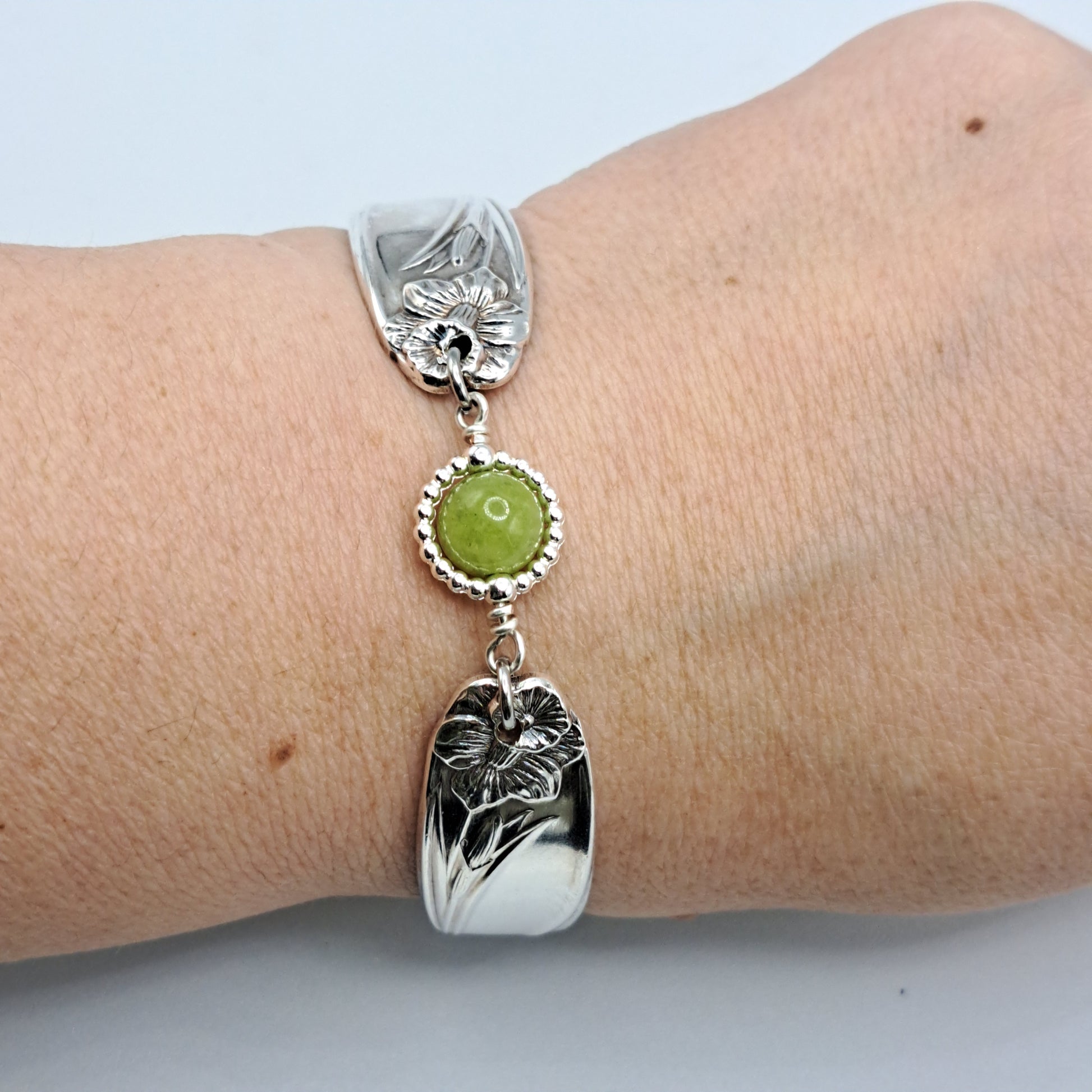 Handmade vintage silverware bracelet made from Daffodil 1950 pattern silverplated handles with center charm 