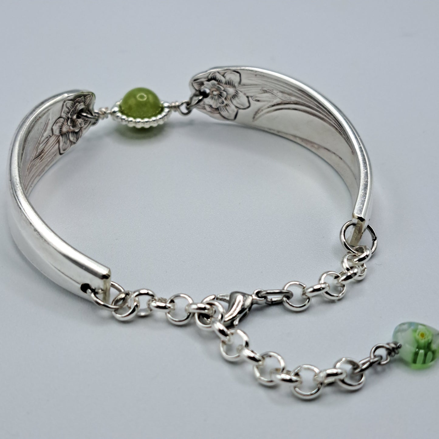 Handmade vintage silverware bracelet made from Daffodil 1950 pattern silverplated handles with center charm 