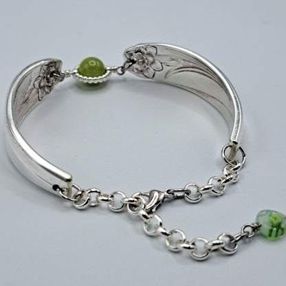 Handmade vintage silverware bracelet made from Daffodil 1950 pattern silverplated handles with center charm 