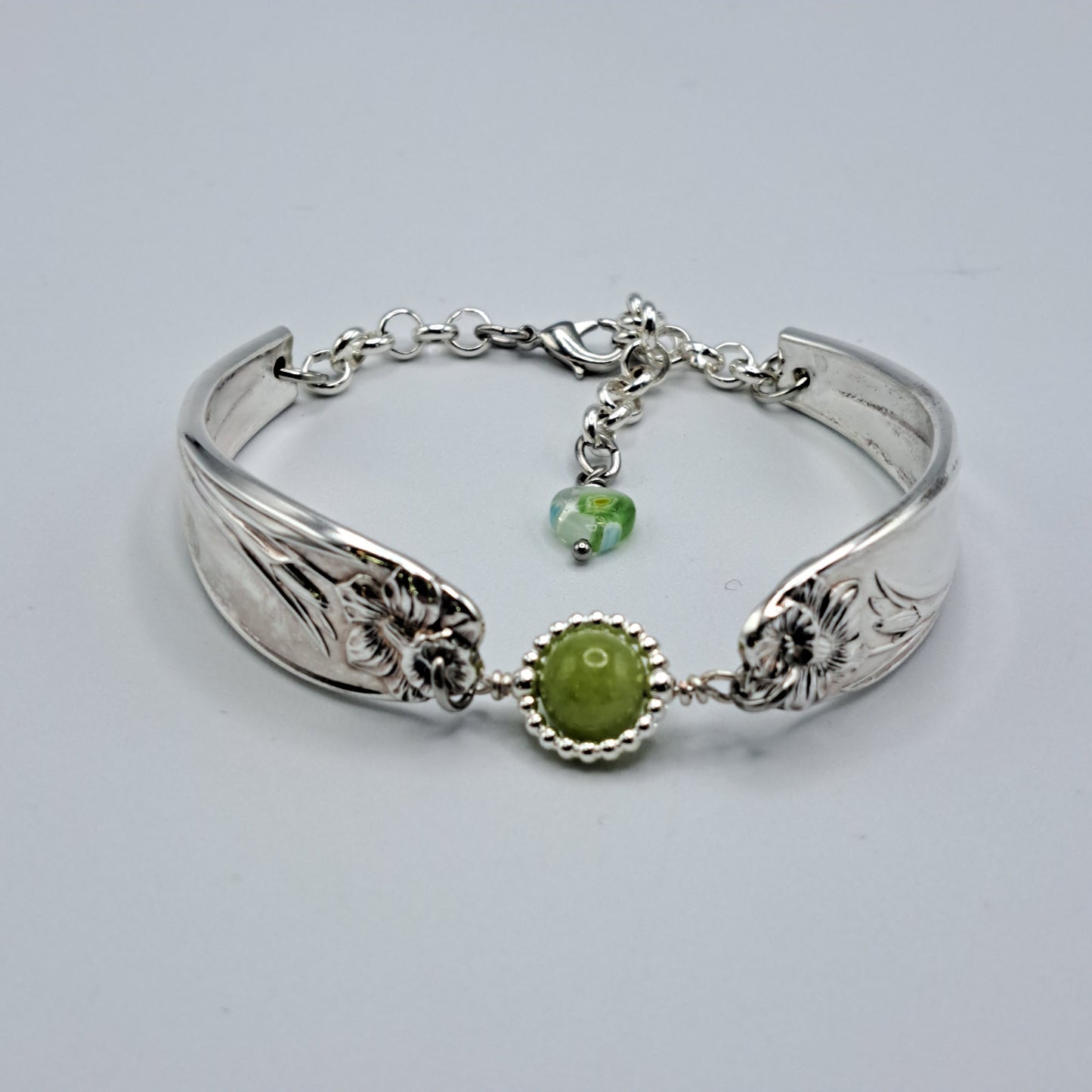 Handmade vintage silverware bracelet made from Daffodil 1950 pattern silverplated handles with center charm 