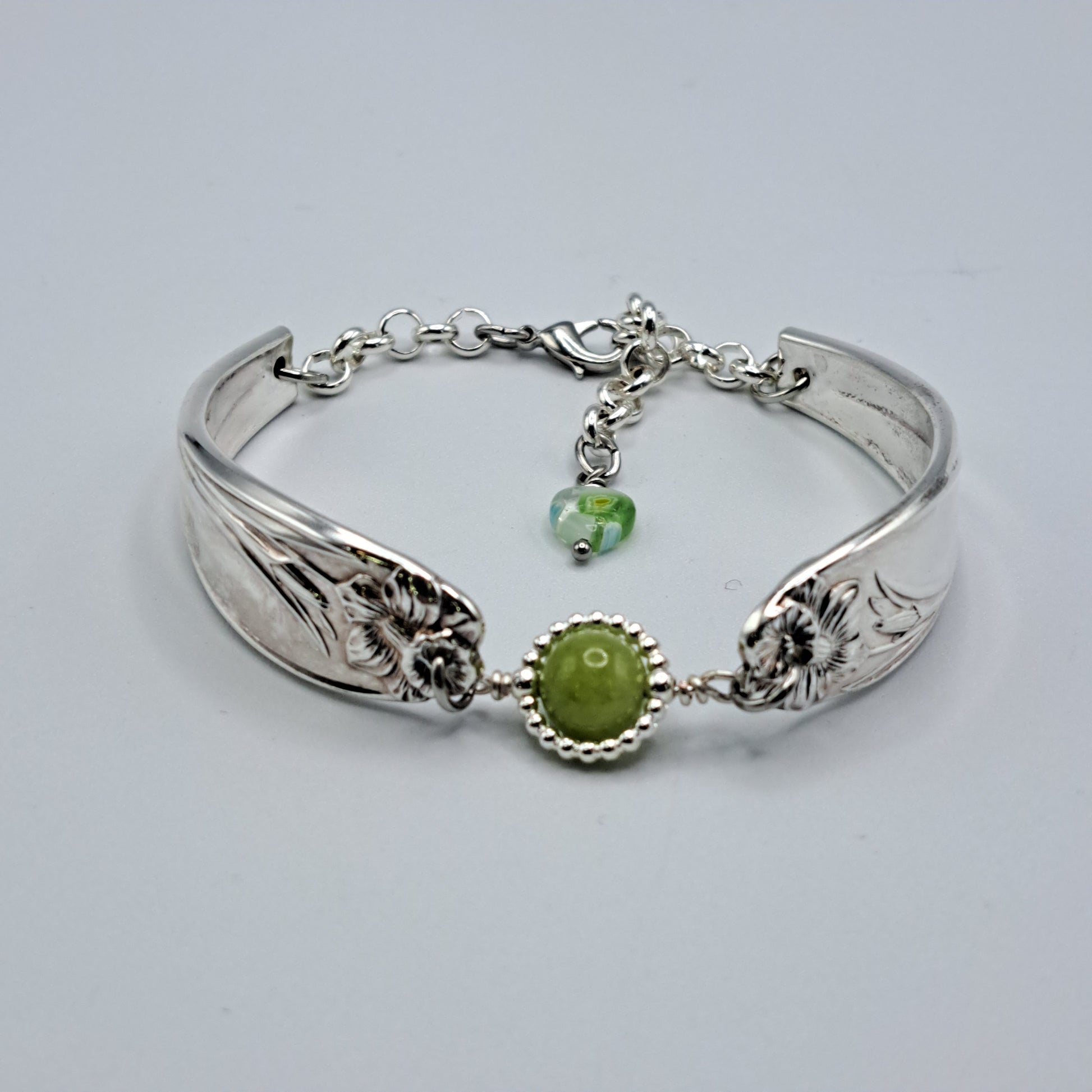 Handmade vintage silverware bracelet made from Daffodil 1950 pattern silverplated handles with center charm 