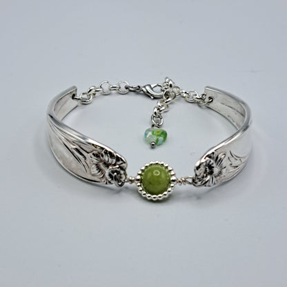 Handmade vintage silverware bracelet made from Daffodil 1950 pattern silverplated handles with center charm 