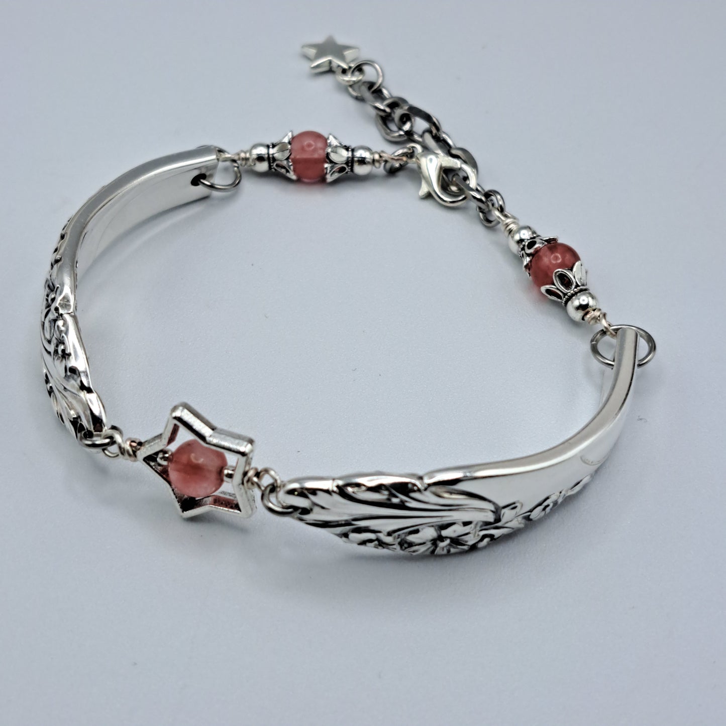Handmade vintage silverware bracelet made from Evening Star 1950 silverplated handles with center cherry quartz and side beads