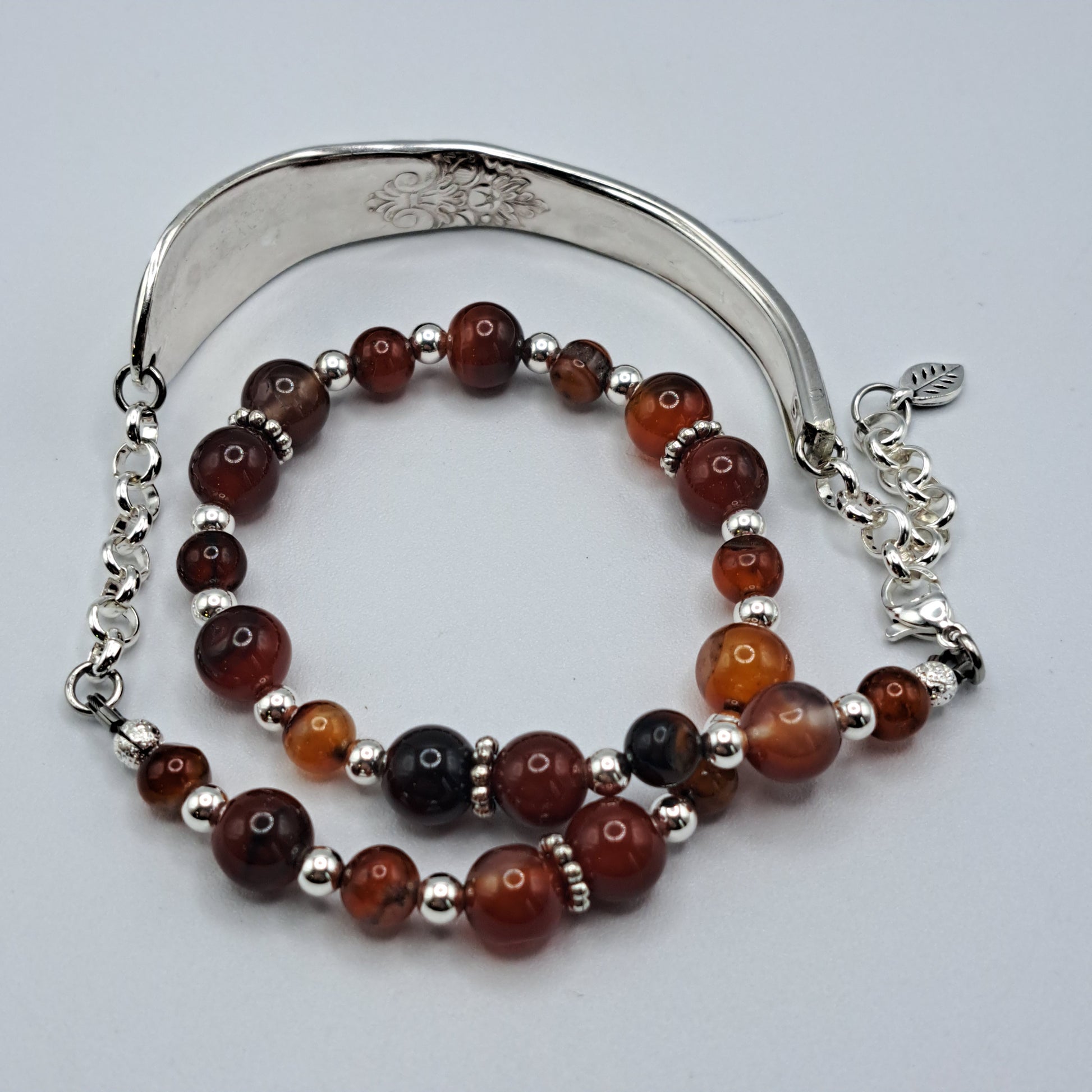 Handmade vintage silverware bracelet made from Adoration 1939 pattern silverplated handles with fire agate gemstone beads